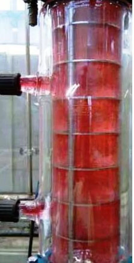Agitated glass extraction column