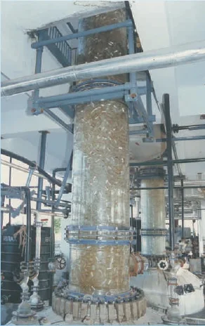 Distillation assembly over a glass-lined reactor