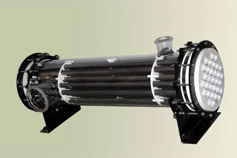 Glass shell heat exchanger with graphite tubes